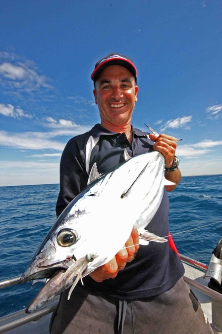 Matt Cini from Reel Time Charters displays a Stripey while getting his clients into the action © Jarrod Day